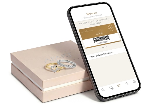 Aplikace ADC zobrazená na chytrém telefonu. Telefon leží na šperkovnici Apart.
