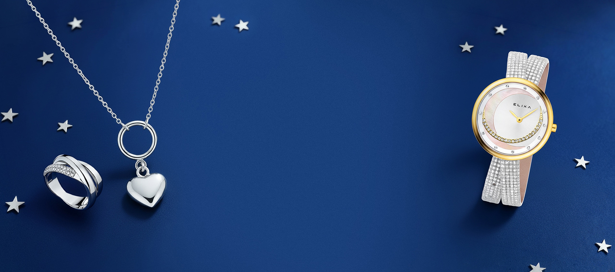 Zlatý přívěsek a hodinky elixa na vánočním pozadí