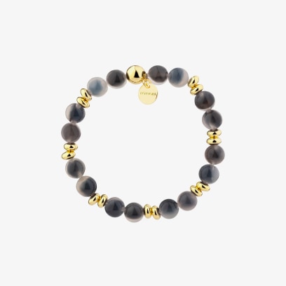 Zlatý náramek s černými korálky