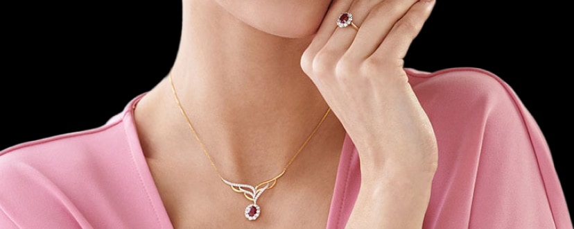 Náhrdelník ze žlutého zlata a prsten s diamanty a rubíny