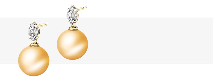 Zlaté náušnice s velkými zlatými perlami z jižních moří a prvkem osazeným diamanty.