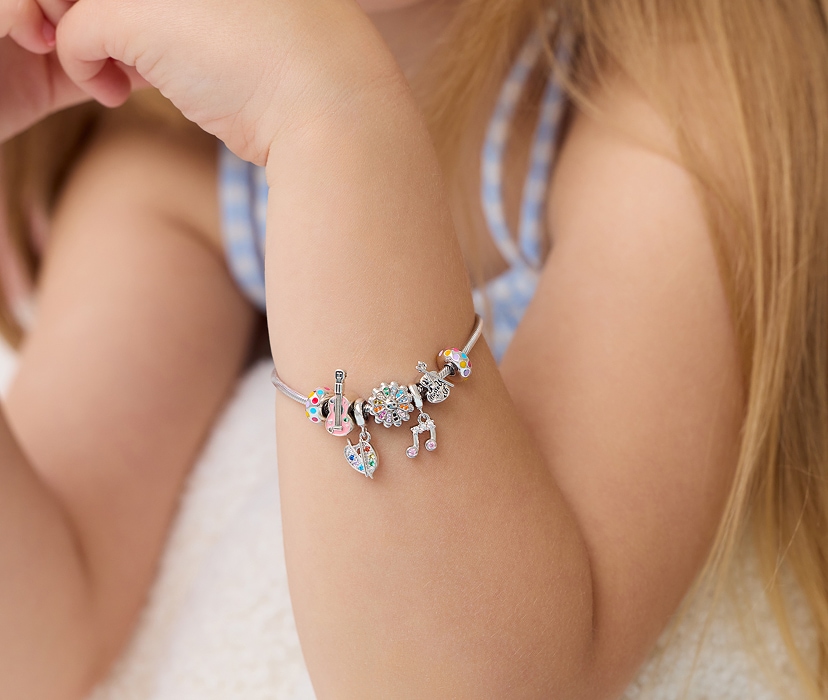 Silver beads bracelet for a child - set - cello, painter's palette, flower, musical note, guitar on a child's hand