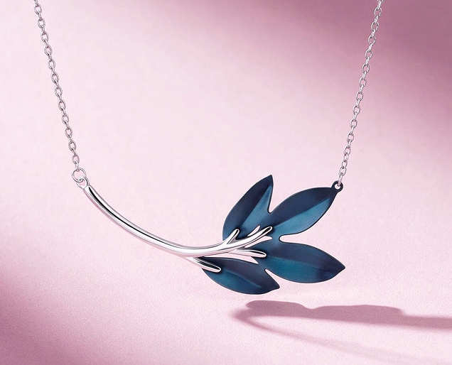 Silver necklace with a blue leaf motif