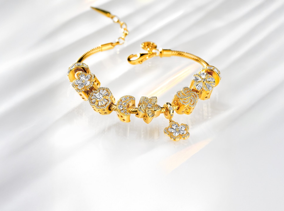 gold bracelet with beads pendants