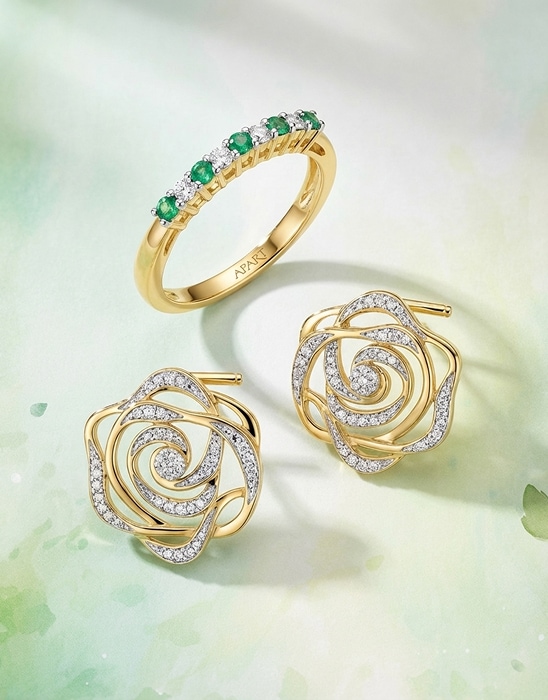 Gold ring and gold earrings decorated with cubic zirconias