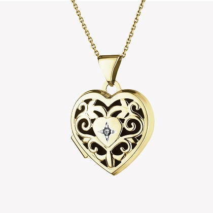 Yellow gold pendant with a diamond - heart