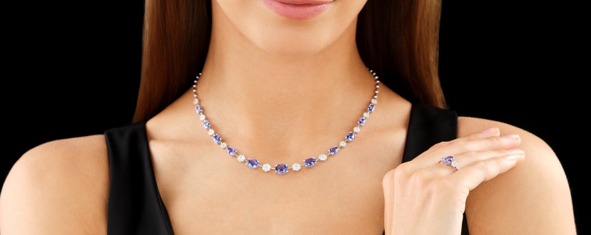 White gold necklace and ring with diamonds and tanzanite