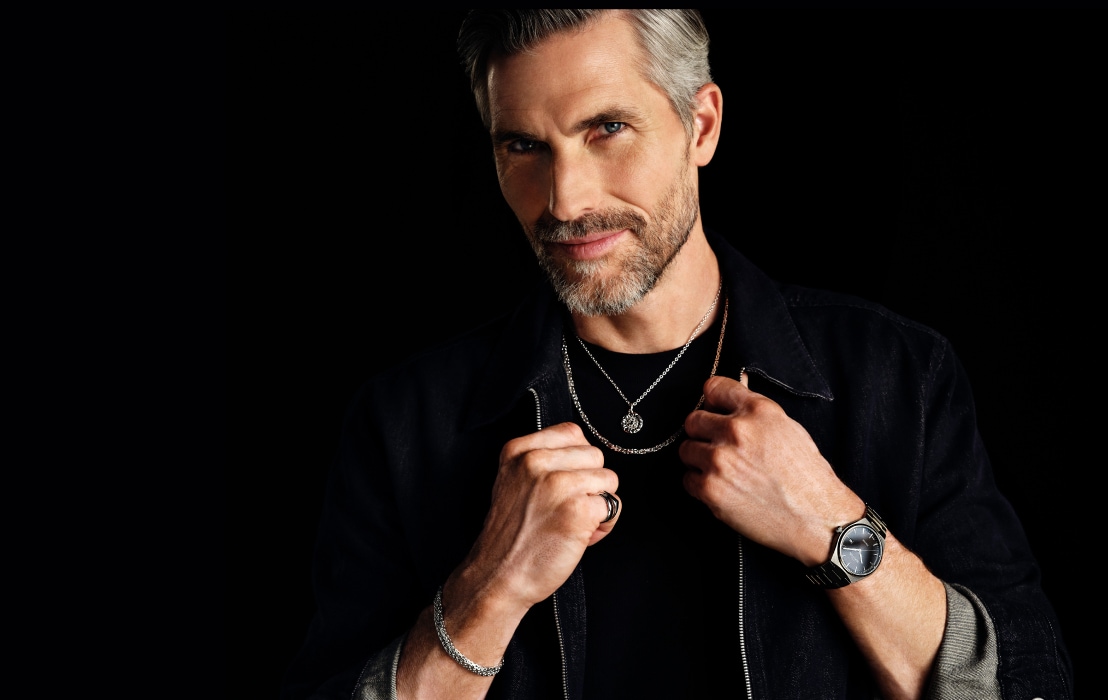 A man in men's jewelry and watch styling