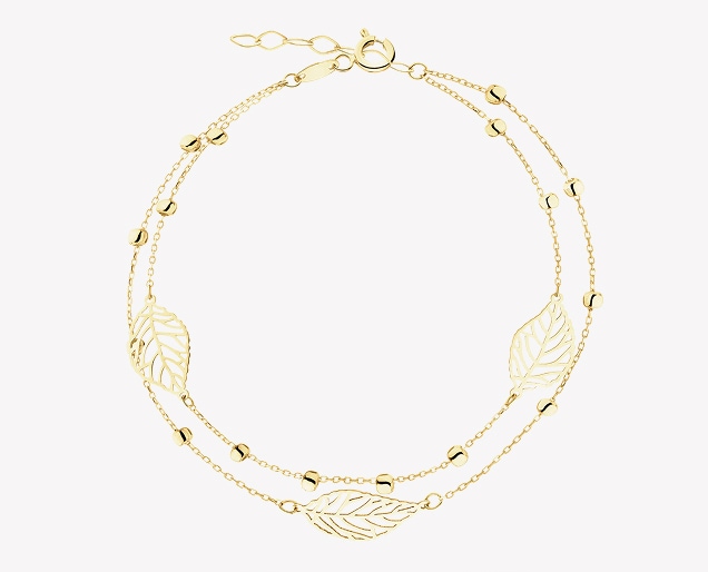 Złota bansoletka w motywie liści