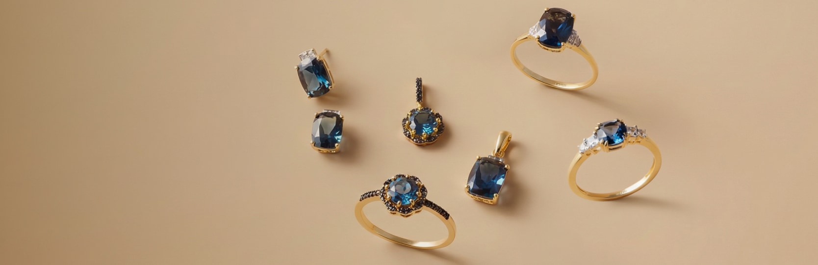 Zestaw biżuterii z żółtego złota z czarnymi brylantami i topazem London Blue