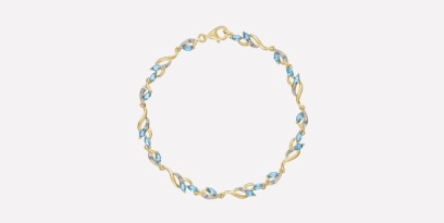 Bransoletka z żółtego złota z diamentami i topazami