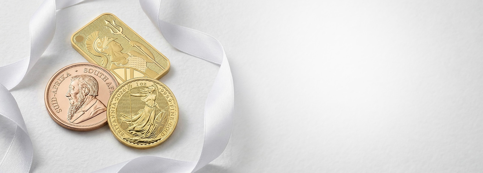 Złote monety oraz złota sztabka