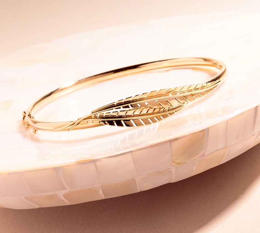 Złota bransoletka w motywie liści