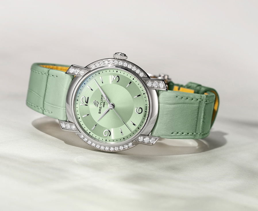 Elegancki damski zegarek Breitling z miętowo-zieloną tarczą i paskiem