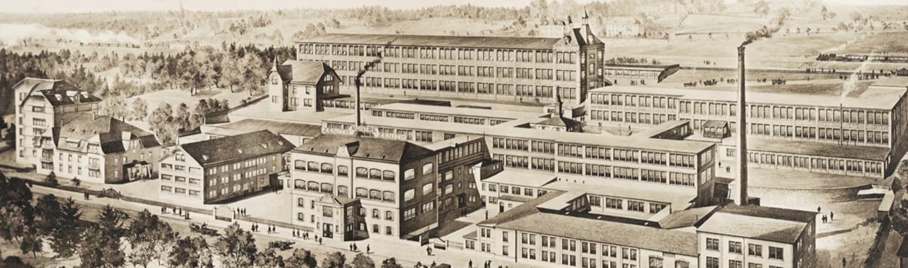 Historyczna ilustracja fabryki Zenith Montré – panorama zakładu przemysłowego z początku XX wieku