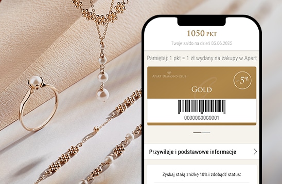 Smartphone z otwartą aplikacją Apart Diamond Club na tle złotej biżuterii