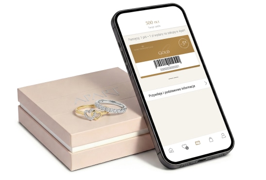 Aplikacja ADC wyświetlona na smartphonie. Telefon oparty o pudełko do biżuterii Apart