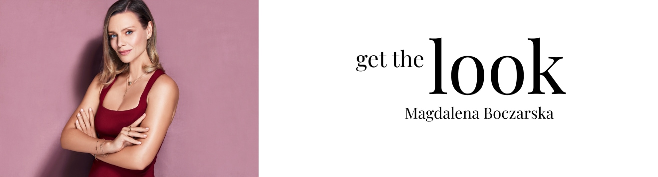 Magdalena Boczarska w czerwonej sukience prezentująca biżuterię