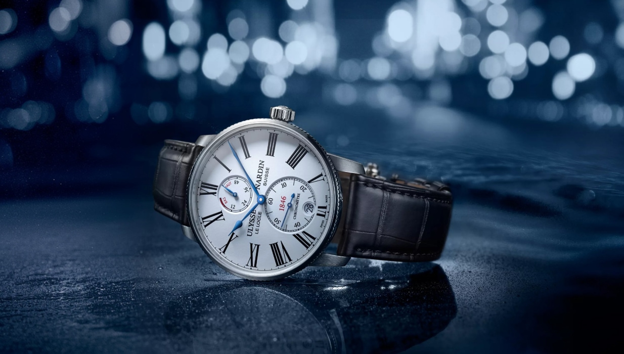 Luksusowy męski zegarek Ulysse Nardin na skórzanym pasku z białą tarczą i niebieskimi wskazówkami