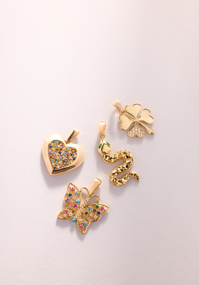 Złote zawieszki z cyrkoniami - wąż, motyl, serce, koniczyna