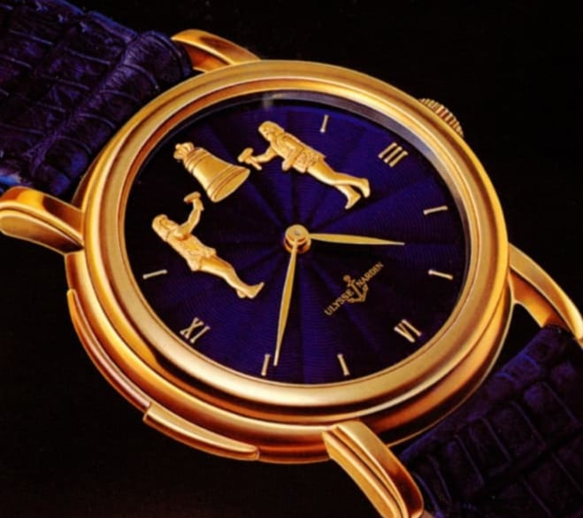 Złoty zegarek Ulysse Nardin z figurkami dzwonników na ciemnoniebieskiej tarczy