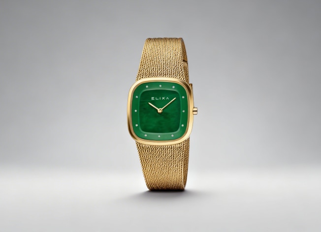 Gold-colored watch with a green dial