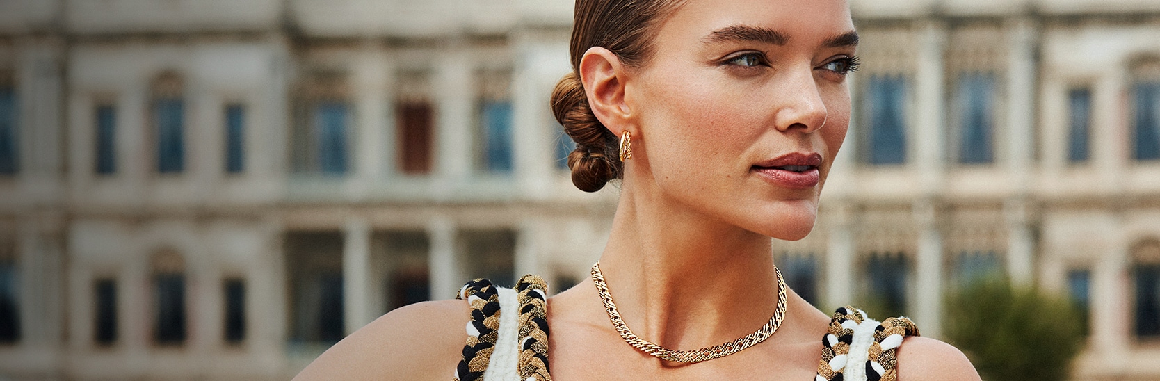 Zosia Nowak presenting gold-plated earrings and a necklace